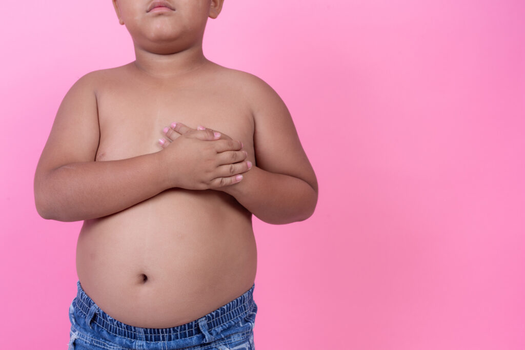 Obese boy who is overweight on a pink background-陳榮堅醫師 健康--源起-減重大視界